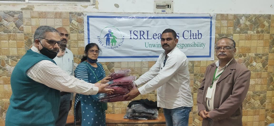 Members giving Sweaters donated by Life Members Vinay Choudhury & Satyanarayan Agrawal