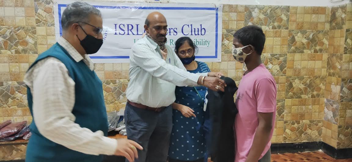Executive Body Members giving sweater to an inmate at Adruta Children\'s Home