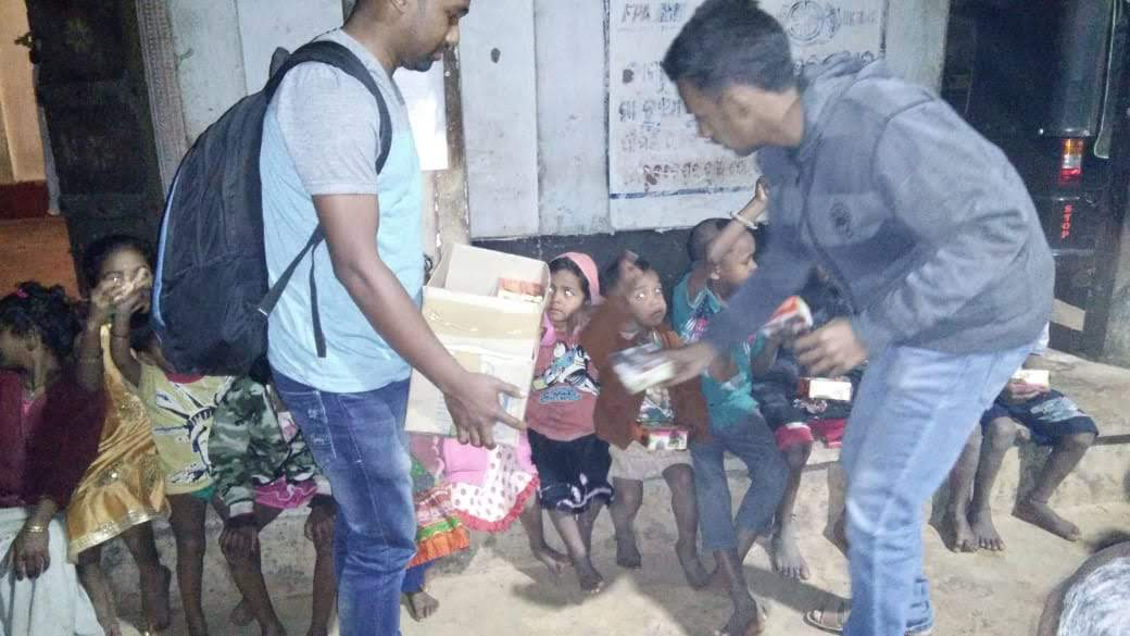 Distribution of food packets at a slum area in Bhubaneswar