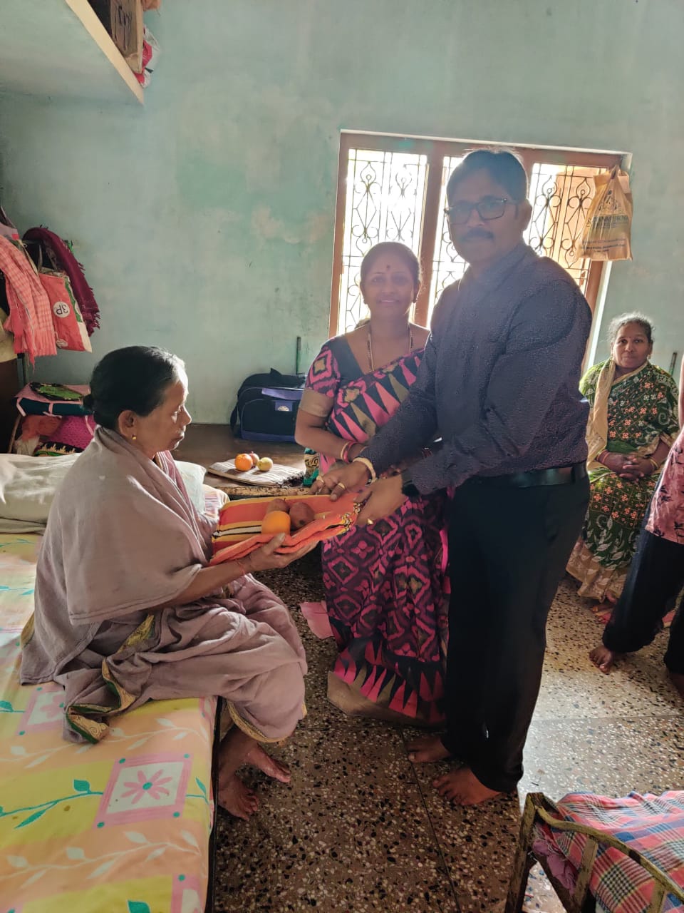 Leaders distributing blankets and fruits at an Old Age Home near Berhampur